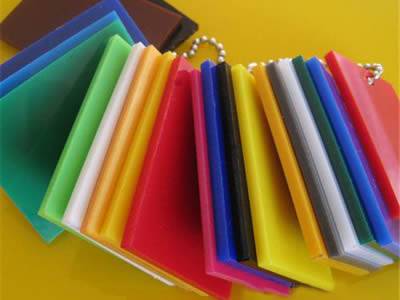 Several clear acrylic sheets with different colors on yellow background.