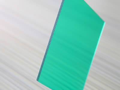 A piece of green solid polycarbonate sheet for sound barrier.